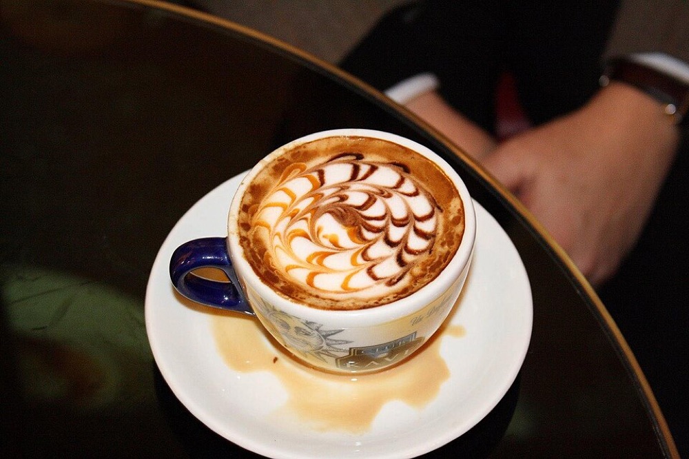 Illustrative stock photograph: Cappuccino with latte art on Coffee Right in Brno, Brno-City District. This may differ from the café's actual product.
